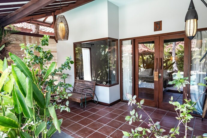 Imagen de la habitación del Hotel Belukar Villas. Foto 19