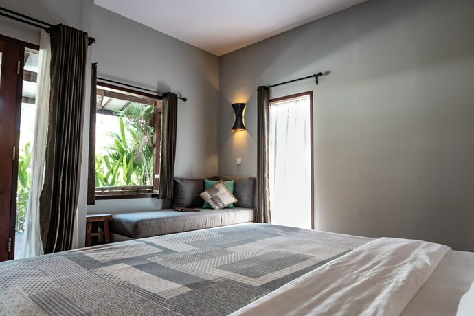 Imagen de la habitación del Hotel Belukar Villas. Foto 22