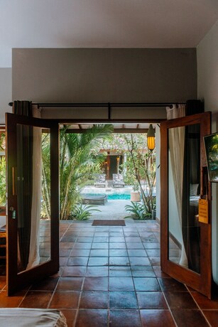 Imagen de la habitación del Hotel Belukar Villas. Foto 33