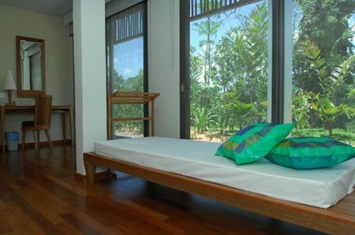 Imagen de la habitación del Hotel Belum Rainforest Resort. Foto 12