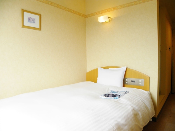 Imagen de la habitación del Hotel Benex Yonezawa. Foto 11