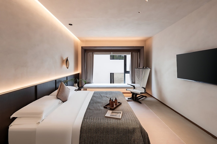 Imagen de la habitación del Hotel Benjue Rushi Guesthouse Taoxichuan. Foto 11