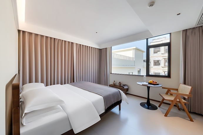 Imagen de la habitación del Hotel Benjue Rushi Guesthouse Taoxichuan. Foto 12