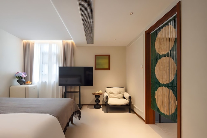 Imagen de la habitación del Hotel Benjue Rushi Guesthouse Taoxichuan. Foto 13