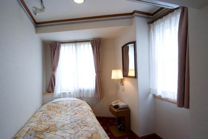 Imagen de la habitación del Hotel Beppu Station. Foto 15