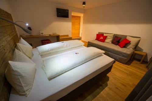 Imagen de la habitación del Hotel Berghotel Tgantieni. Foto 8