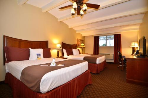 Imagen de la habitación del Hotel Best Western Plus Coach House. Foto 7