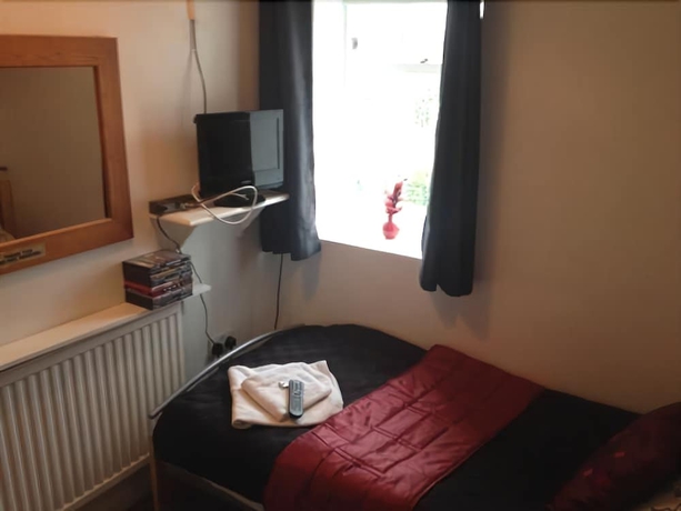 Imagen de la habitación del Hotel Beverley Guest House. Foto 13