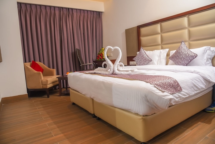 Imagen de la habitación del Hotel Bharawan Clarks Inn Express. Foto 9