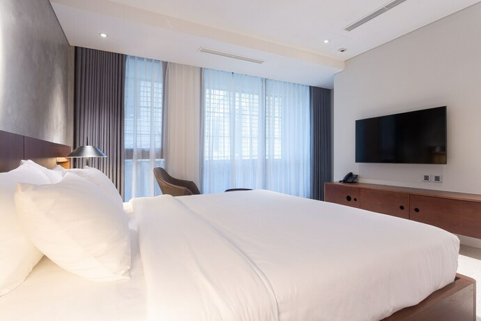 Imagen de la habitación del Hotel Bi Ecosuites Hanoi. Foto 17