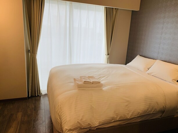 Imagen de la habitación del Hotel Bibi Kokusai Dori. Foto 26