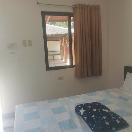 Imagen de la habitación del Hotel Binubusan Beach and Resort. Foto 17