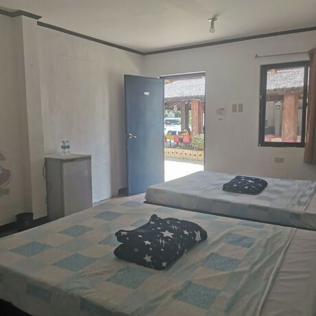 Imagen de la habitación del Hotel Binubusan Beach and Resort. Foto 18