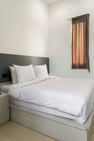 Imagen de la habitación del Hotel Binumar Guest House. Foto 17