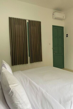 Imagen de la habitación del Hotel Binumar Guest House. Foto 20