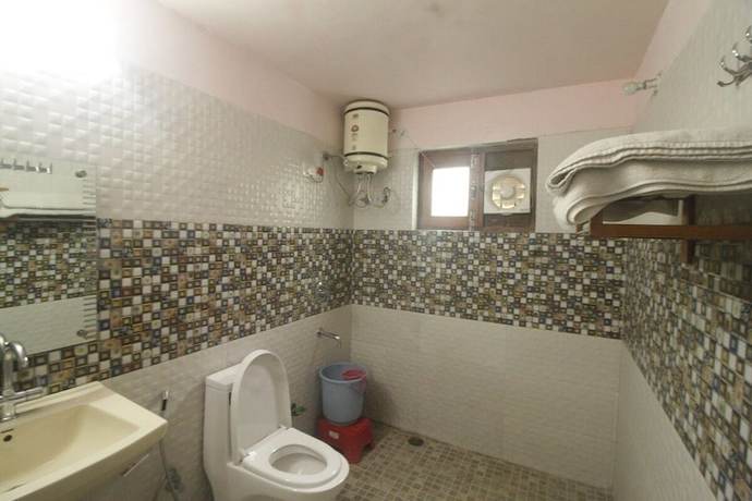 Imagen de la habitación del Hotel Birders Den Eco Resort. Foto 9