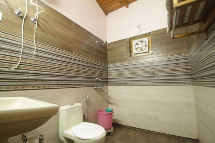Imagen de la habitación del Hotel Birders Den Eco Resort. Foto 12