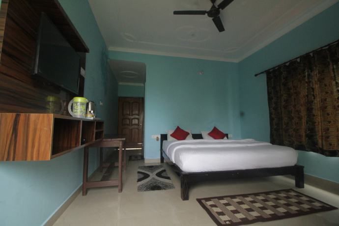 Imagen de la habitación del Hotel Birders Den Eco Resort. Foto 13
