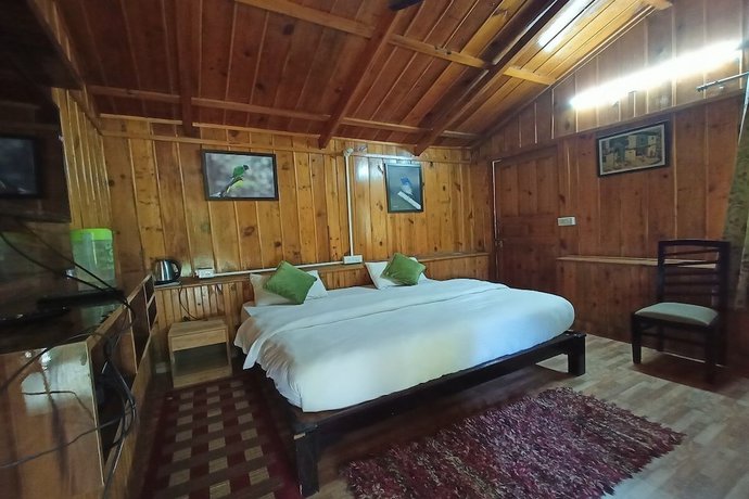 Imagen de la habitación del Hotel Birders Den Eco Resort. Foto 15