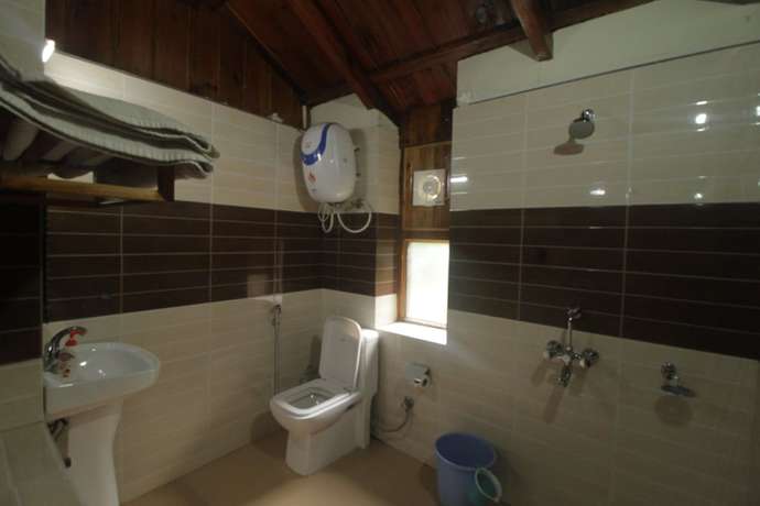 Imagen de la habitación del Hotel Birders Den Eco Resort. Foto 16