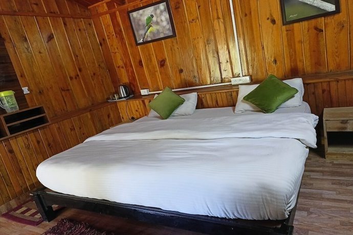 Imagen de la habitación del Hotel Birders Den Eco Resort. Foto 18