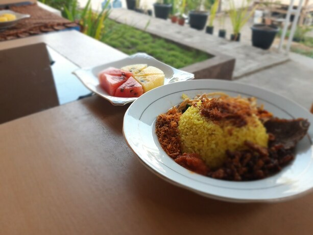 Imagen del bar/restaurante del Hotel Bis Homestay. Foto 20