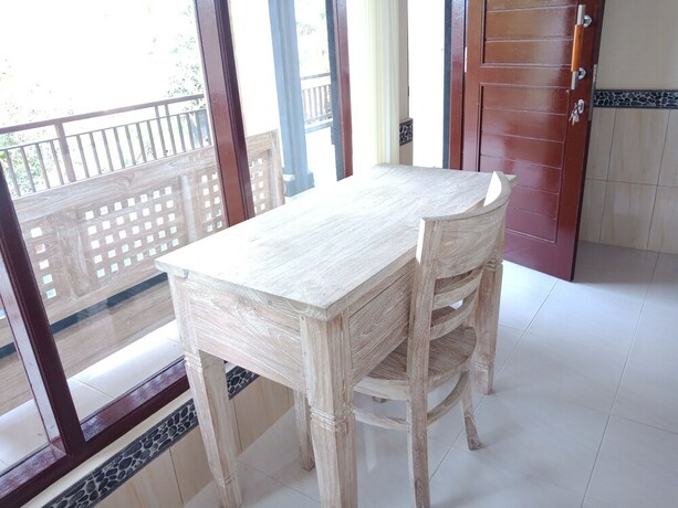 Imagen de la habitación del Hotel Bisma Jaya Bungalow. Foto 22