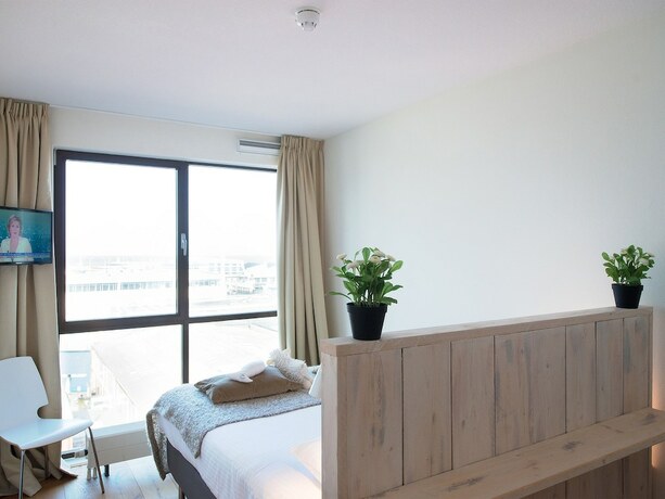 Imagen de la habitación del Hotel BizStay Harbour Scheveningen Apartments. Foto 13