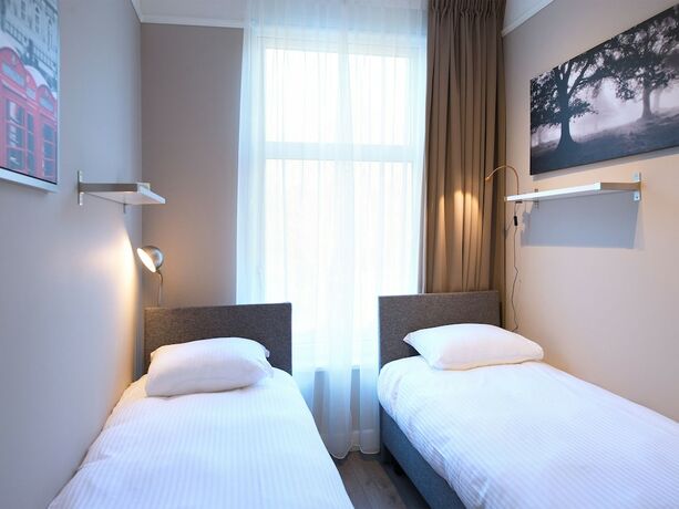 Imagen de la habitación del Hotel BizStay Park Central Apartments. Foto 19