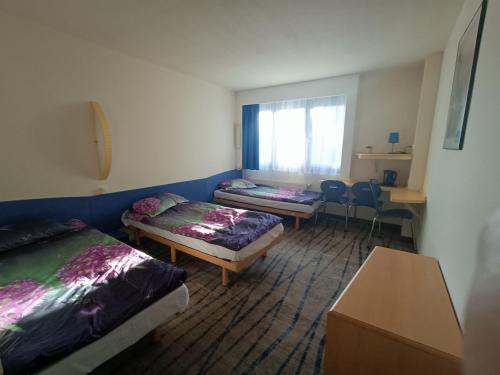 Imagen de la habitación del Hotel Bizzhotel. Foto 17
