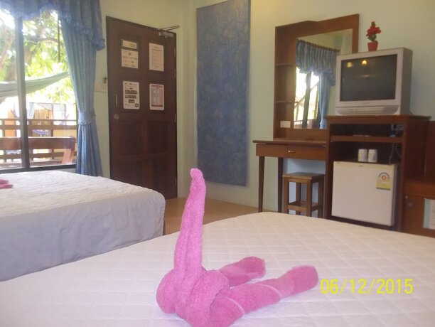 Imagen de la habitación del Hotel Black and White Bungalows. Foto 17