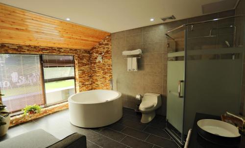 Imagen de la habitación del Hotel Blooming Lotus. Countryside Villa.yixing. Foto 7