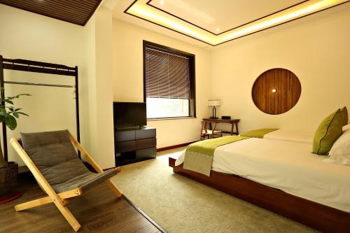 Imagen de la habitación del Hotel Blooming Lotus. Countryside Villa.yixing. Foto 8