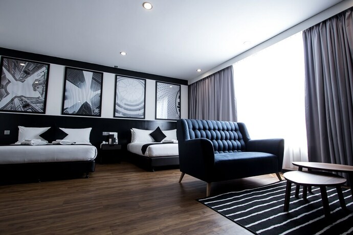 Imagen de la habitación del Hotel Bloommaze Boutique. Foto 14