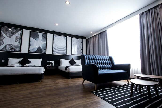 Imagen de la habitación del Hotel Bloommaze Boutique. Foto 18