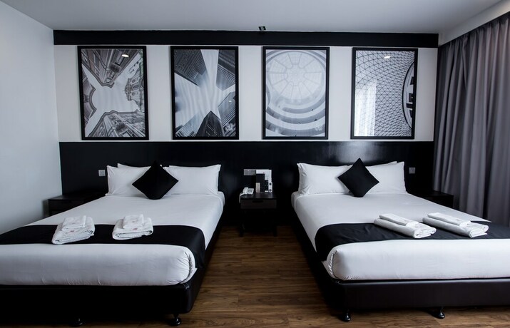 Imagen de la habitación del Hotel Bloommaze Boutique. Foto 22