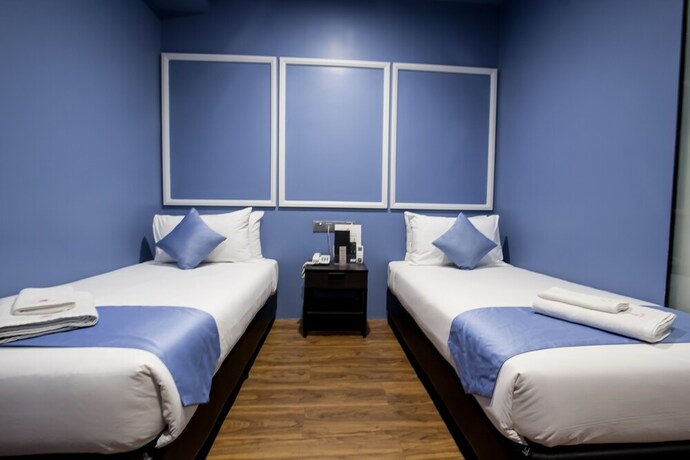 Imagen de la habitación del Hotel Bloommaze Boutique. Foto 28