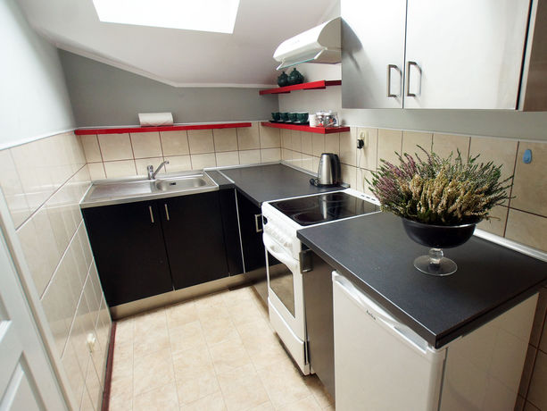 Imagen de la habitación del Hotel Blooms Inn and Apartments. Foto 12