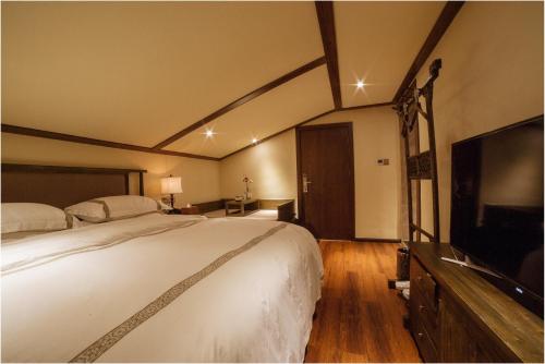 Imagen de la habitación del Hotel Blossom Dynasty Inn. Foto 8