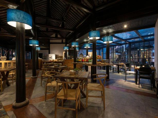 Imagen del bar/restaurante del Hotel Blossom Hill Inn Suzhou Shantang. Foto 7