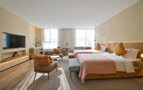 Imagen de la habitación del Hotel Blossom House Suzhou. Foto 11