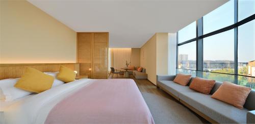 Imagen de la habitación del Hotel Blossom House Suzhou. Foto 12