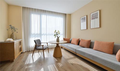 Imagen de la habitación del Hotel Blossom House Suzhou. Foto 15