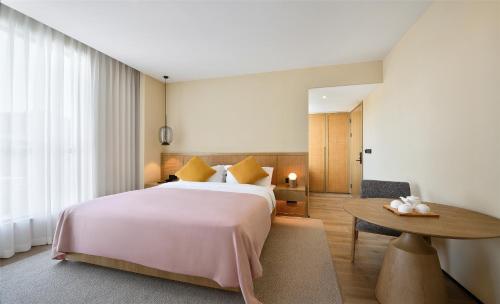 Imagen de la habitación del Hotel Blossom House Suzhou. Foto 16