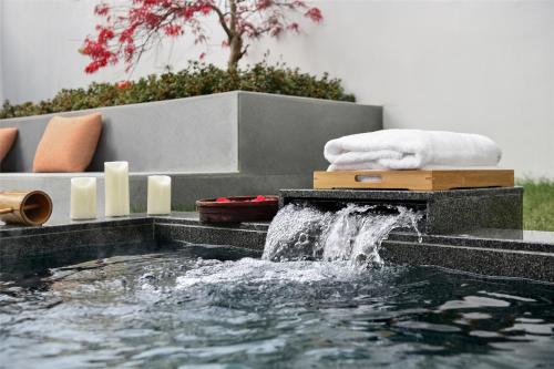Imagen de la habitación del Hotel Blossom House Suzhou. Foto 17