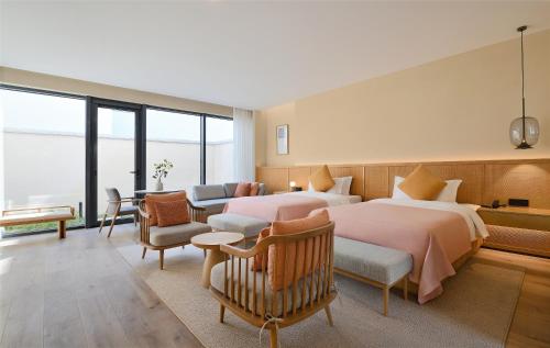 Imagen de la habitación del Hotel Blossom House Suzhou. Foto 18
