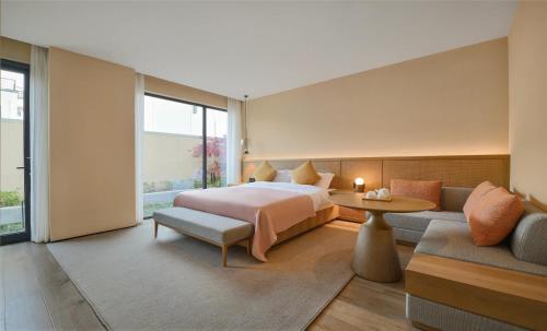 Imagen de la habitación del Hotel Blossom House Suzhou. Foto 20