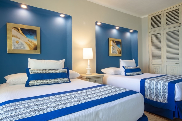 Imagen de la habitación del Hotel Blue Chairs Beachfront Resort Puerto Vallarta - Adults Only. Foto 16