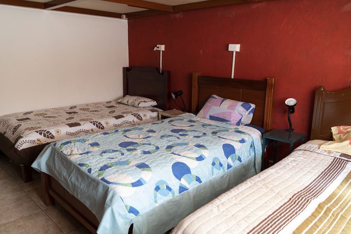 Imagen de la habitación del Hotel Blue Door Housing Historic Quito. Foto 16