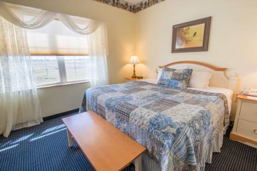 Imagen de la habitación del Hotel Blue Gate Garden Inn. Foto 16